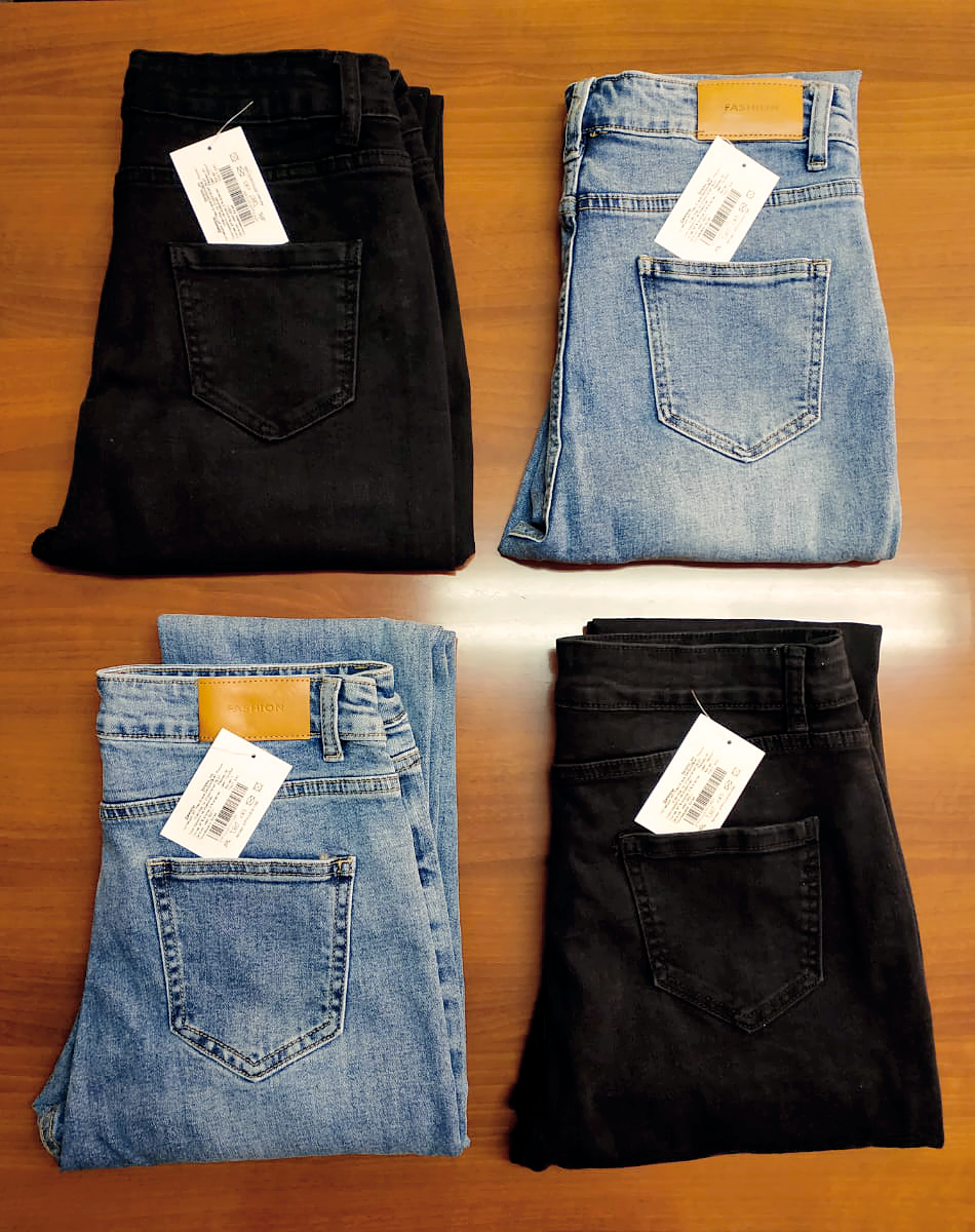 Finished jeans folded with barcode and product tags before packing and shipment